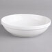 A Villeroy & Boch white porcelain salad bowl on a gray background.