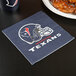 A Houston Texans luncheon napkin on a table.