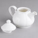 A Villeroy & Boch white porcelain teapot with a lid and handle.
