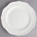 A white Villeroy & Boch porcelain plate with a scalloped edge.
