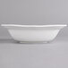 A Villeroy & Boch white porcelain square salad bowl with a curved edge.