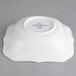 A white Villeroy & Boch square salad bowl with a small handle.
