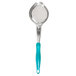 A close-up of a Vollrath teal and silver perforated oval spoon with a blue handle.