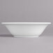 A white Villeroy & Boch porcelain bowl on a gray surface.