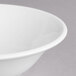 A close-up of a Villeroy & Boch white porcelain bowl with a white rim.