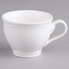 A close-up of a Villeroy & Boch white porcelain tea cup with a handle.