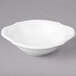 A white Villeroy & Boch porcelain bowl with a handle.