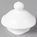 A white round porcelain lid with a small round knob.