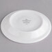 A white Villeroy & Boch porcelain saucer with a small white label.