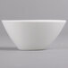 A Villeroy & Boch white porcelain bowl with a small rim on a gray surface.