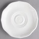 A white Villeroy & Boch porcelain saucer with a circular design.