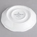 A white Villeroy & Boch porcelain saucer with black text reading "Villeroy & Boch"
