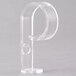 A clear plastic Snap Drape "D" Skirt Clip with a hole and curved handle.