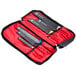 A black and red Mercer Culinary knife case with three knives inside.