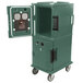 A green Cambro Ultra Camcart hot food holding cabinet with the door open.