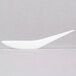 A close up of a Fineline Tiny Temptations white plastic spoon.