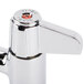 A chrome Equip by T&S deck mount faucet with red handles.