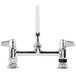 A chrome Equip by T&S deck-mount faucet with two handles.