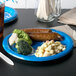 A Creative Converting Detroit Lions paper dinner plate with broccoli and cauliflower on it.