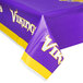 A purple table cover with yellow and white Minnesota Vikings logos.
