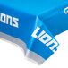 A blue Creative Converting table cover with the Detroit Lions logo in white.