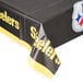 A black and yellow Creative Converting Pittsburgh Steelers plastic table cover with yellow writing and a logo on a table.