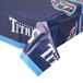 A blue table cover with the Tennessee Titans logo and white text.