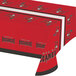 A red table cover with the Tampa Bay Buccaneers logo and a pirate design.