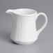 A white Tuxton gravy/sauce boat with a handle.