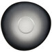 A white porcelain saucer with a black organic design.