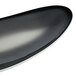 A black porcelain tray with a curved edge.