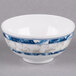 A white bowl with blue and white dragon designs.