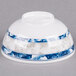 A white melamine bowl with blue dragon designs and blue trim.
