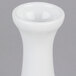 A white porcelain vase with a small neck and white rim.