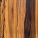 A close-up of a faux acacia wood grain on an American Metalcraft melamine serving peel.