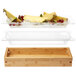 A Rosseto Natura bamboo tray insert with fruit.