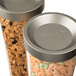 A close-up of a Rosseto double cereal dispenser filled with cereal and nuts.