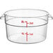 A clear round plastic container with red measurement markings.