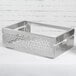 A silver rectangular stainless steel tray with a design on it.