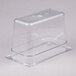 A Carlisle clear polycarbonate food pan with a lid on top.