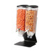 A black steel Rosseto double cereal dispenser filled with nuts and orange food.