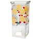 A clear plastic Rosseto beverage dispenser with lemon slices and berries in it.