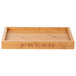 A natural bamboo tray with the word "FRESH" on it.