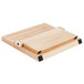 A Mercer Culinary Millennia® rubberwood magnetic board with white and black handles.