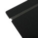 A close up of a black Menu Solutions wood menu board with black rubber bands.