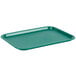 A teal plastic Choice fast food tray on a counter.