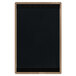 A black rectangular wood menu board with a tan edge.
