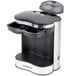 A black and silver Conair Cuisinart two cup coffee maker on a tray.