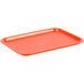 An orange plastic Choice fast food tray on a counter.