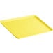 A yellow Cambro market tray with a handle.